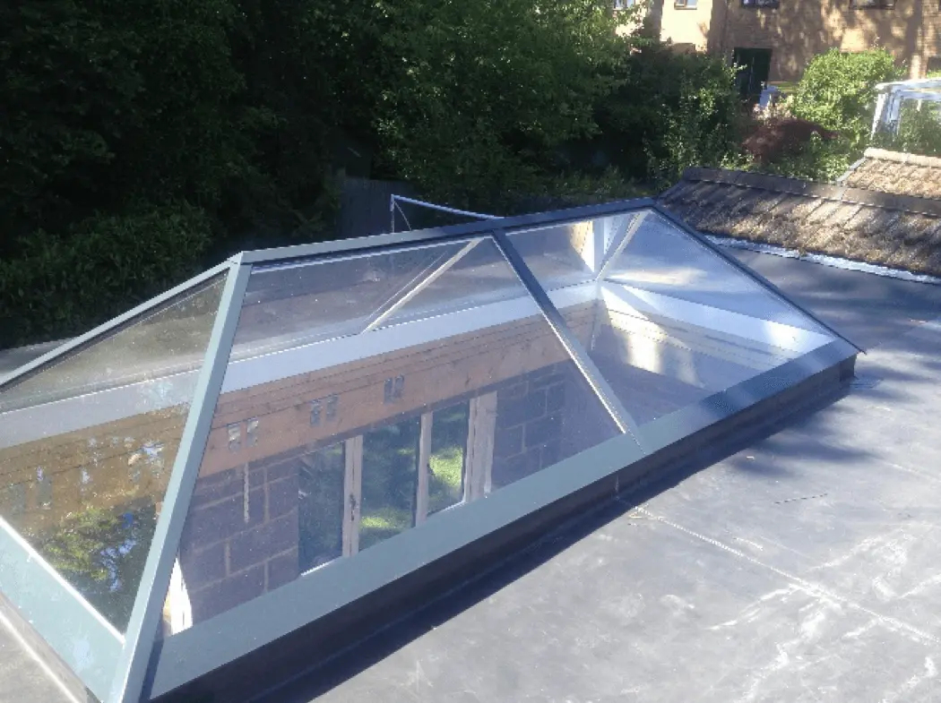 Black EPDM rubber flat roof with a glass roof lantern